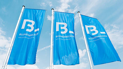 Three Blumenbecker flags in the sky